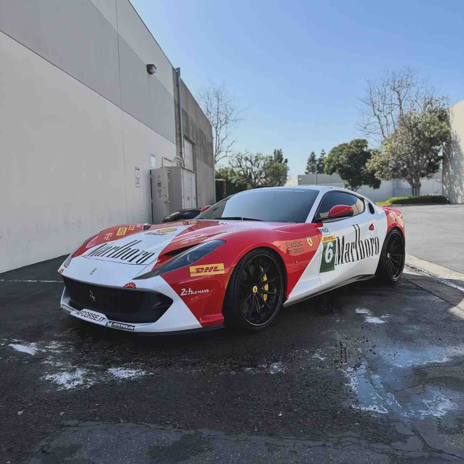 Ferrari 812 wrapped in a red, white and black Le Mans style racing livery