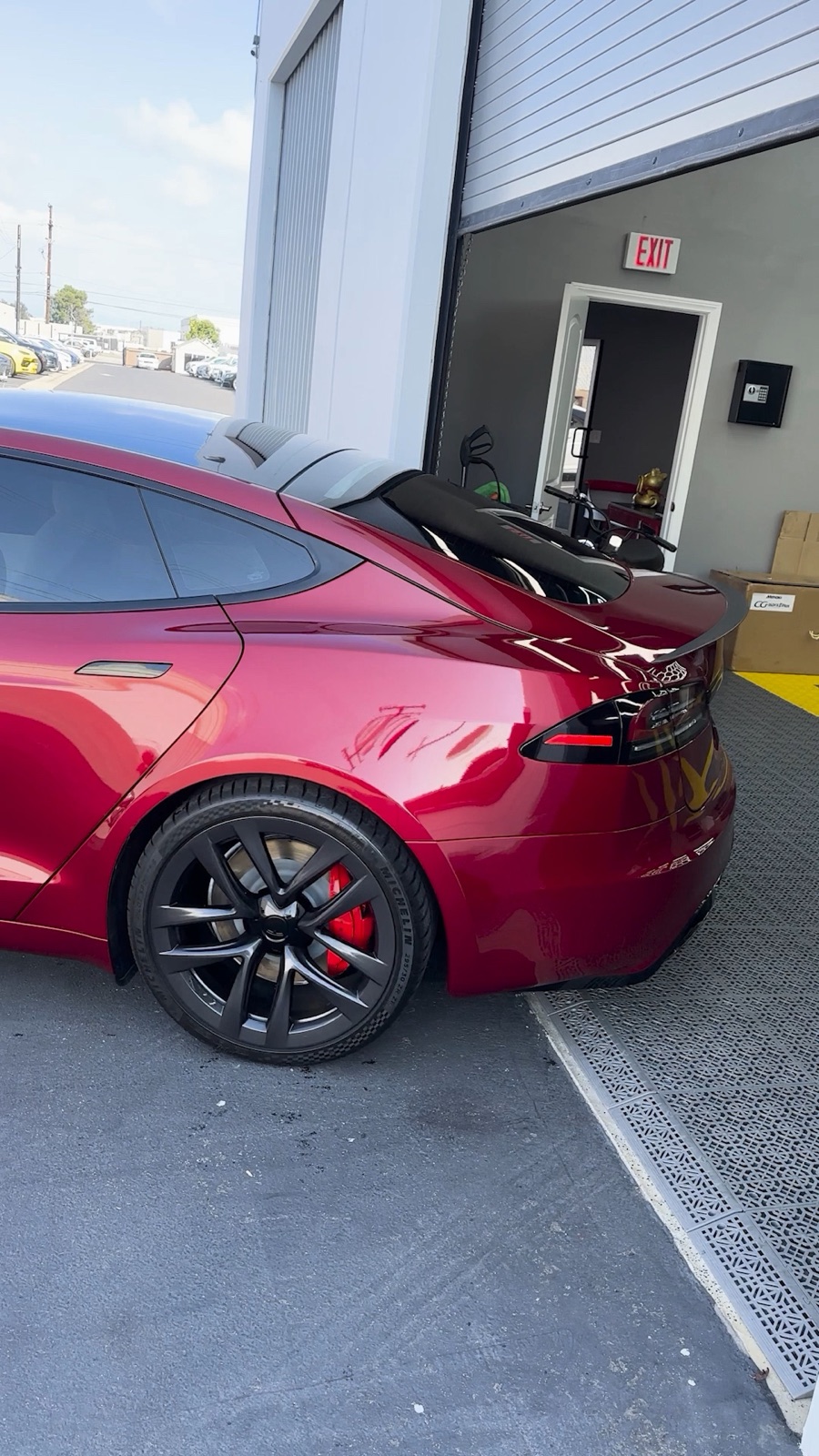 Candy-red Tesla Model S Plaid with a deep-gloss ceramic coating by G Wraps